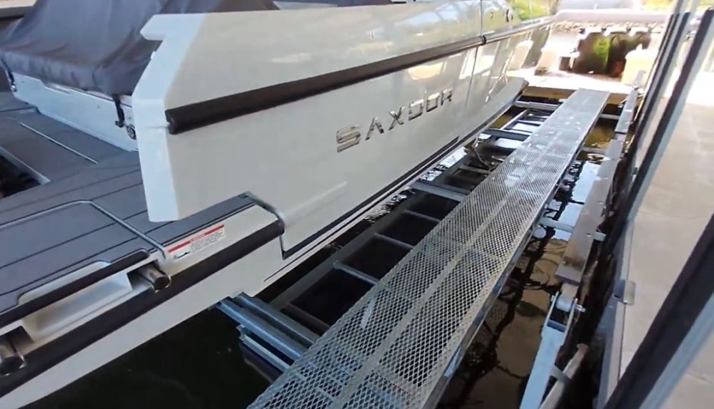 Heavy-duty steel mesh walkway with gusseted supports on LOTO Lift frame